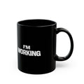 Black mug with 'I'm Working' text on a white background
