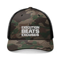 Camouflage cap with 'Execution Beats Excuses' text on a white background
